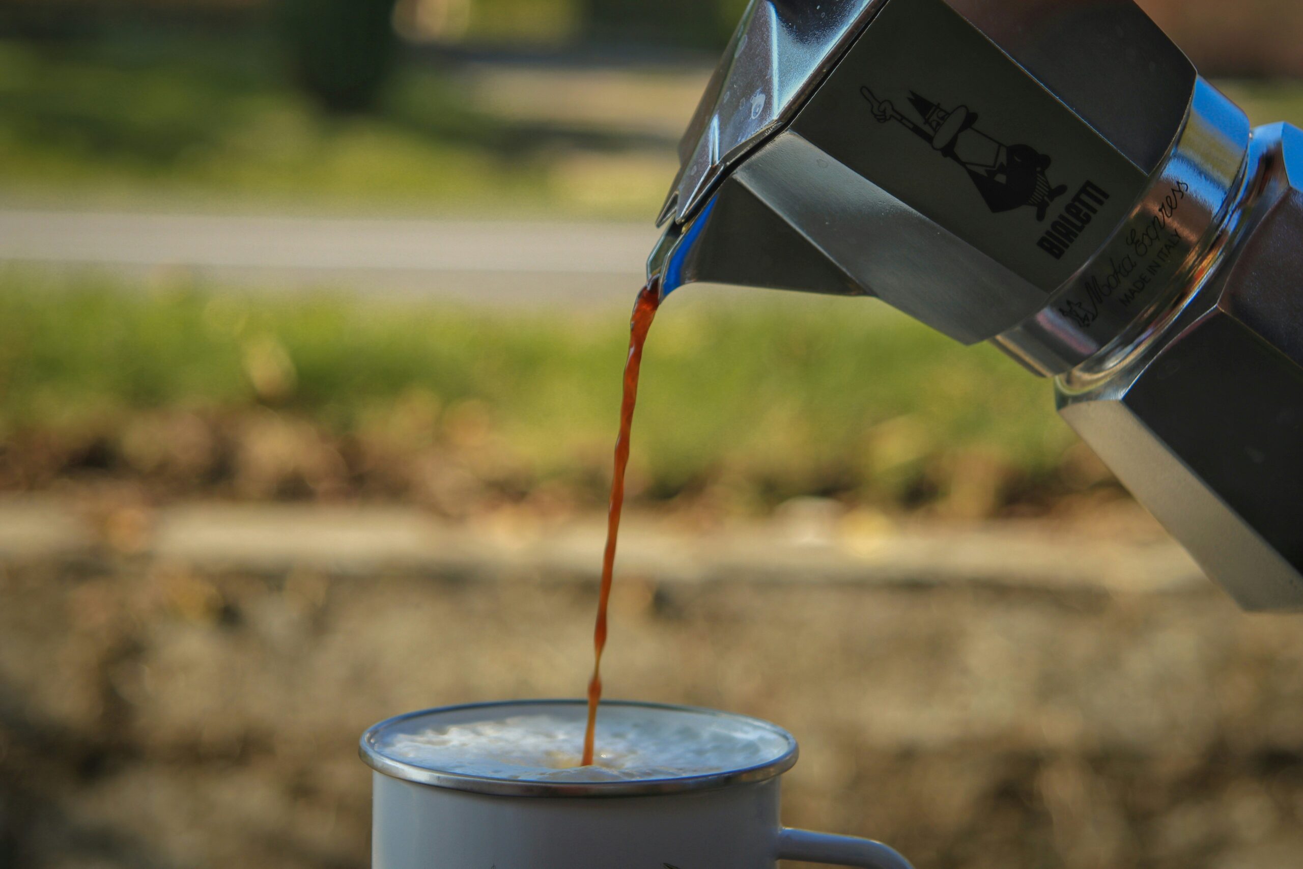 Close-up image showing accumulated oil and debris inside a coffee grinder.