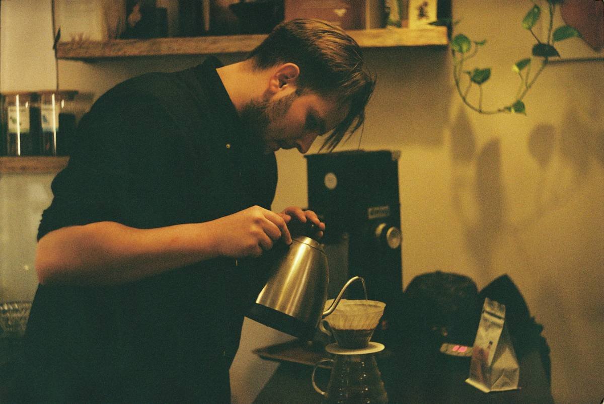 Close-up image showing white mineral deposits inside a coffee maker.