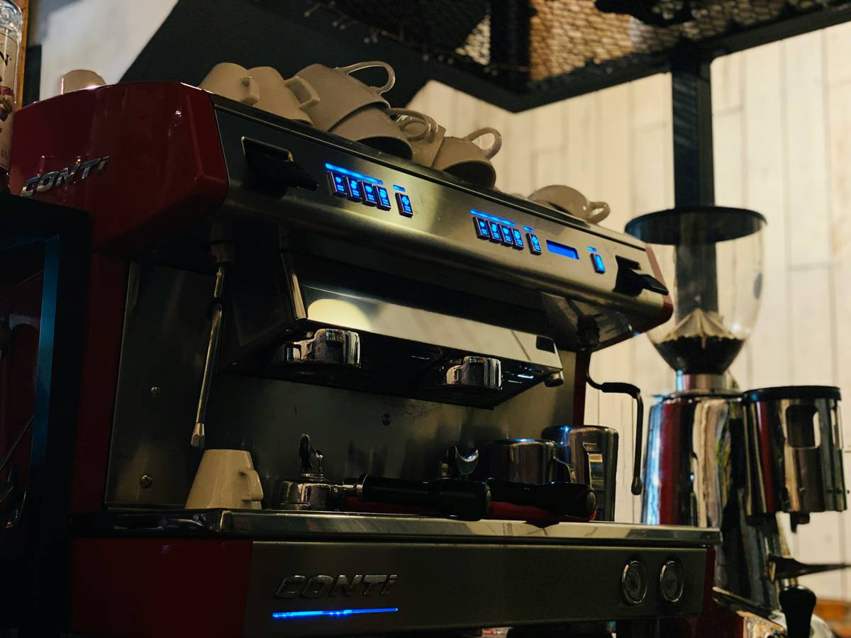 An assembled smart coffee maker sitting on a kitchen counter ready to use.