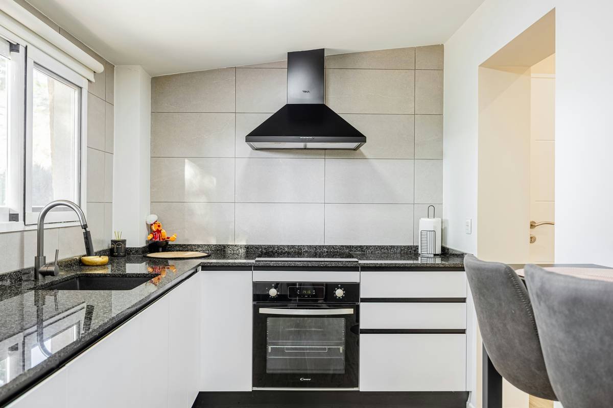 A sleek smart coffee maker brewing a cup of light roast coffee.